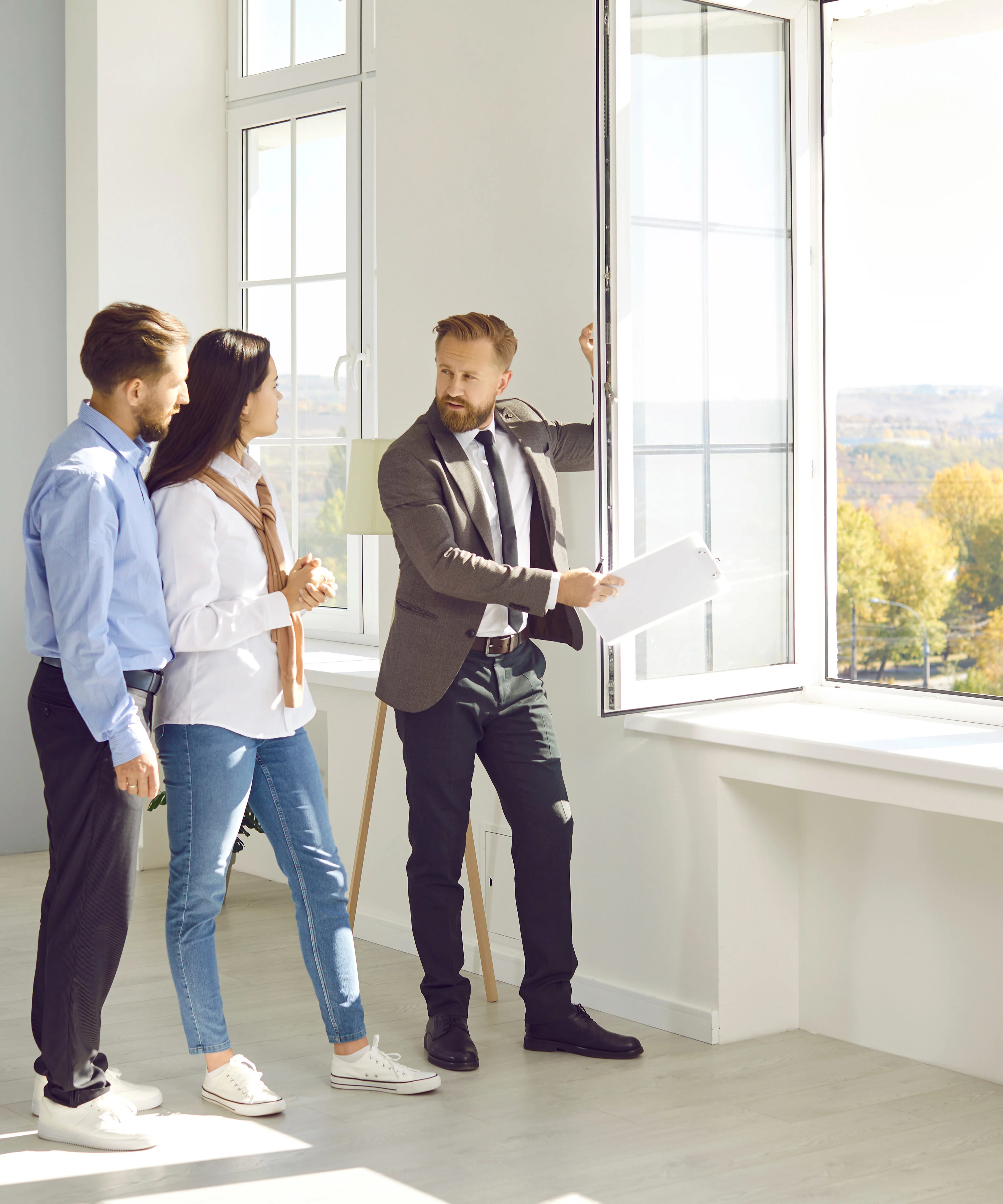 Property manager showing a couple a home