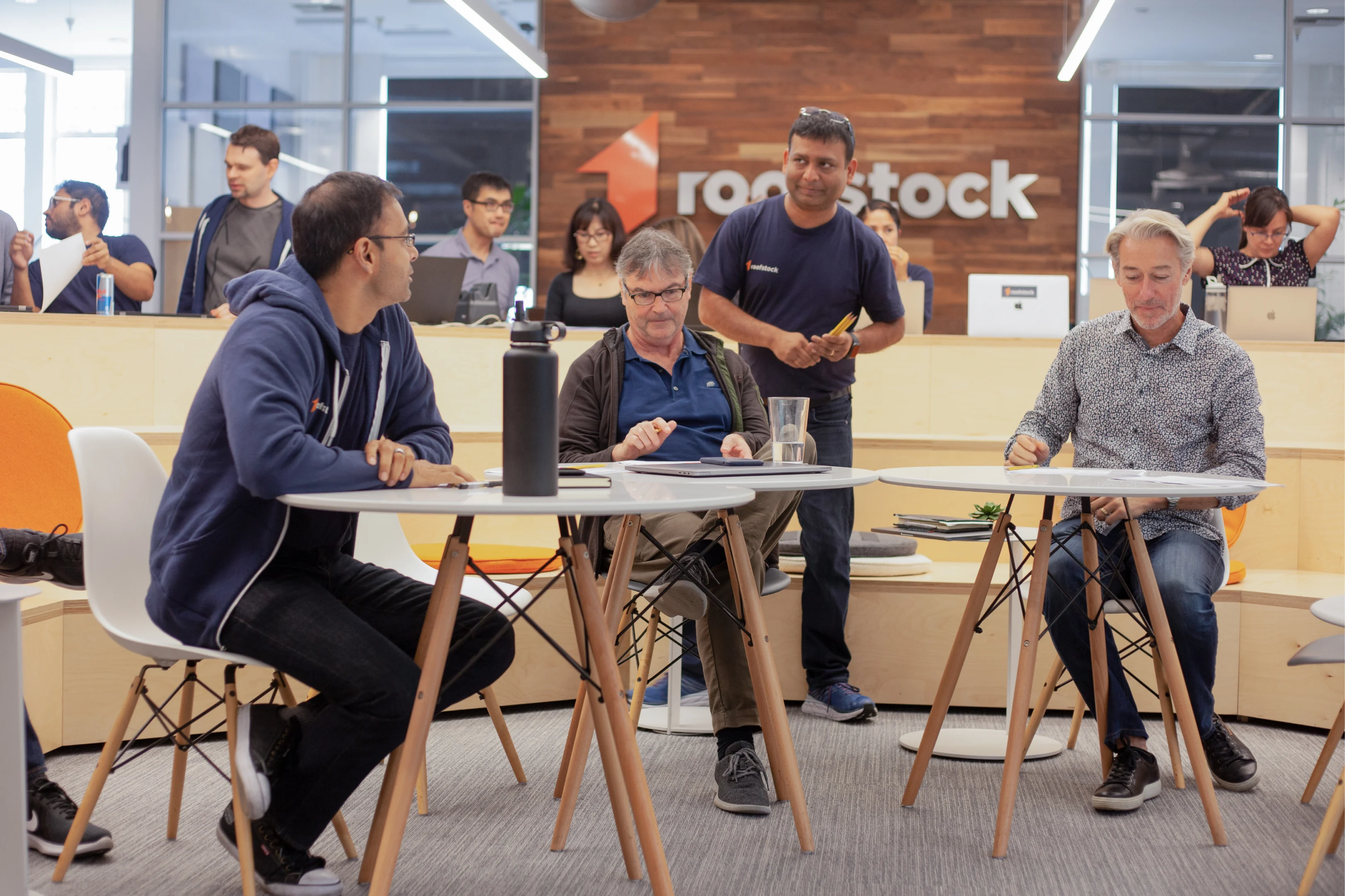 Four men in an office space