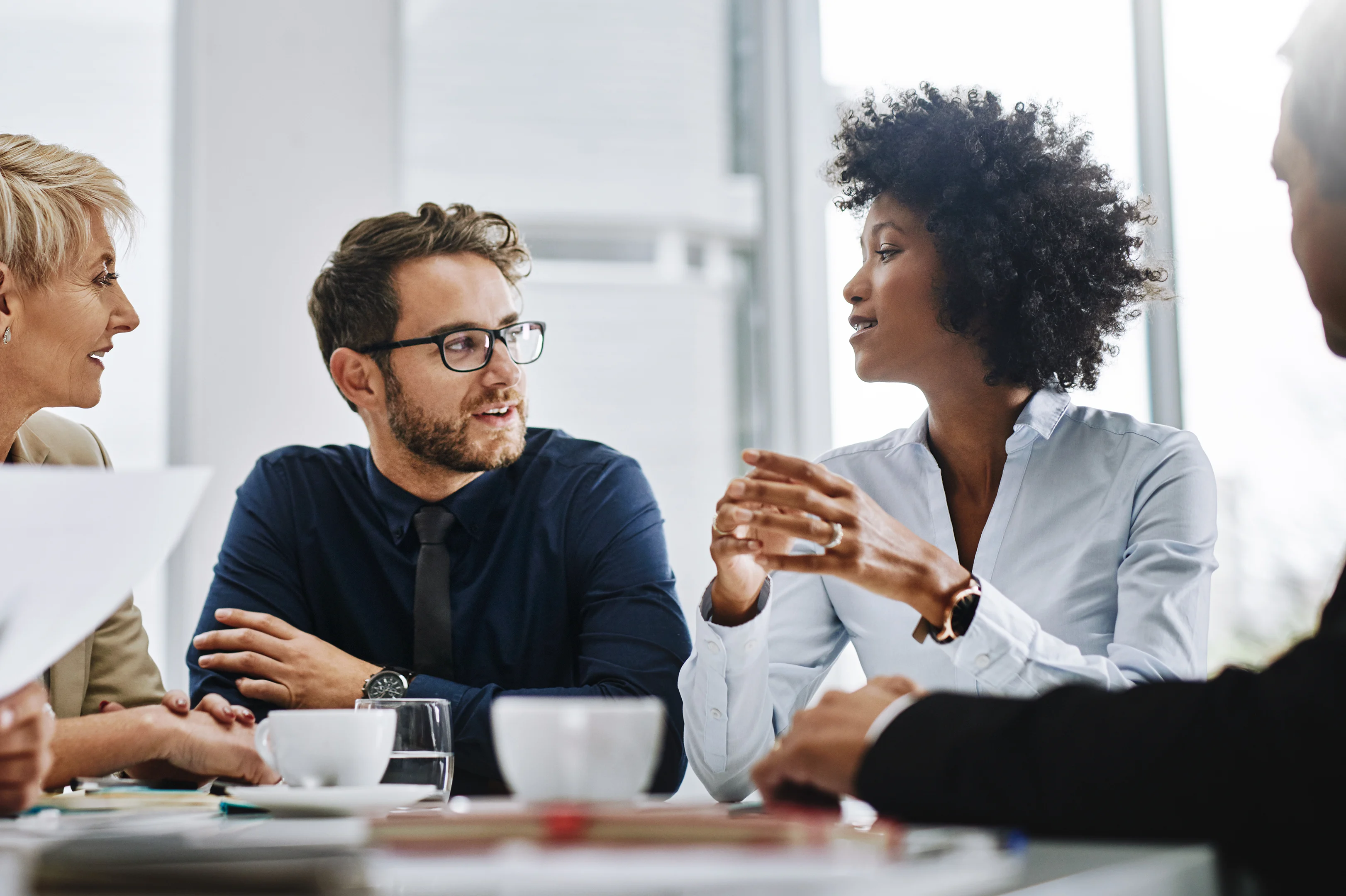 People talking at conference table