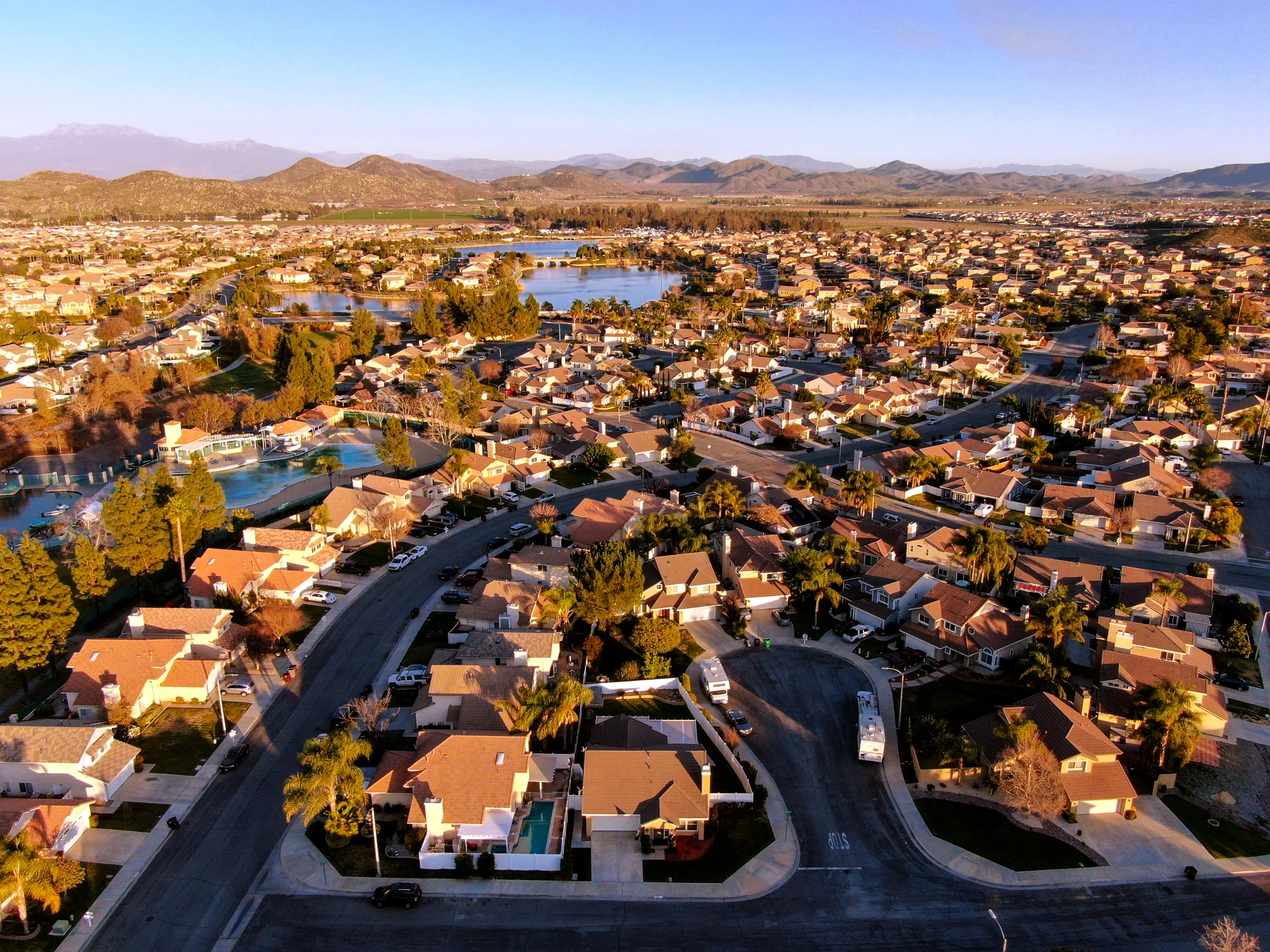 Suburban neighborhood with hills and lake