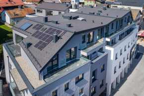 mehrstöckiges Stadthaus Bischofshofen mit Photovoltaikanlage