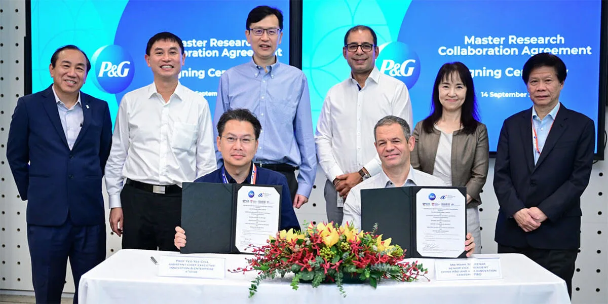 Group photo of people smiling looking towards the camera.