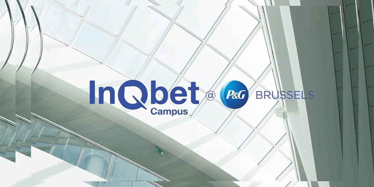 Logo of InQbet Campus at P&G Brussels overlaid on a modern glass building interior.