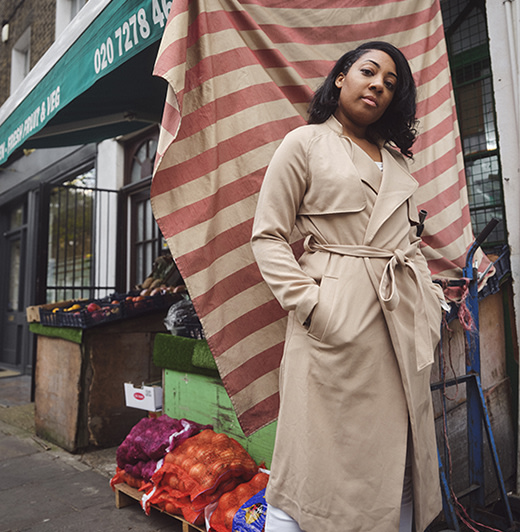 A woman standing outside a grocery story