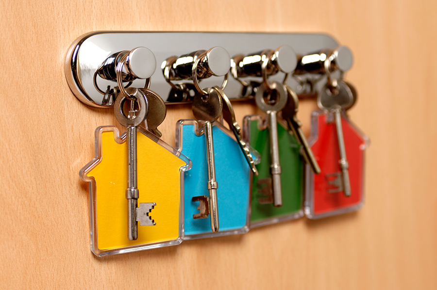 Sets of keys handing on a key holder.