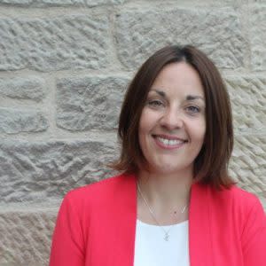 Profile picture of Kezia Dugdale standing in front of a brick wall