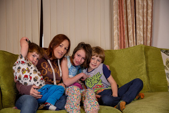 Kim with her three children - George, Sasha and Joshua. They are currently struggling in expensive and insecure private renting after being stuck on different social housing waiting lists for more than a decade.