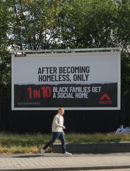 A billboard that reads: After becoming homeless, only 1 in 10 black families get a social home.