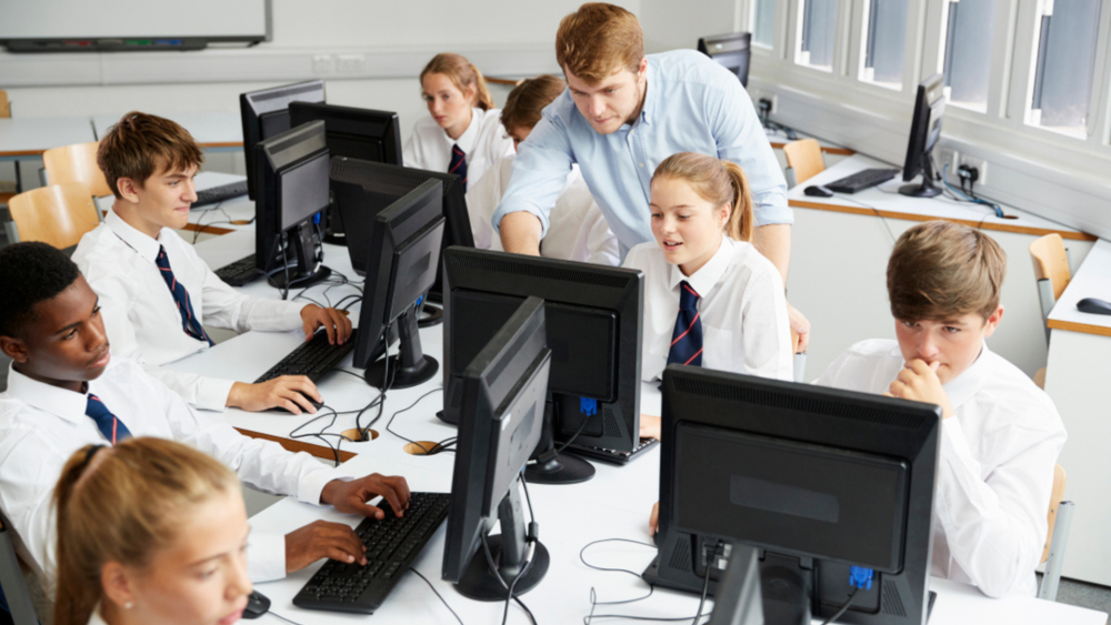 A group of students around their computers