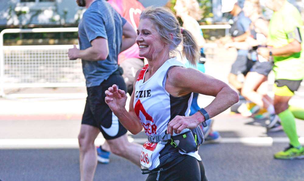 A woman running the Berlin marathon for Shelter