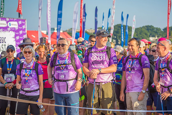 People looking happy as they wait at the start line for the Jurassic Coast Challenge
