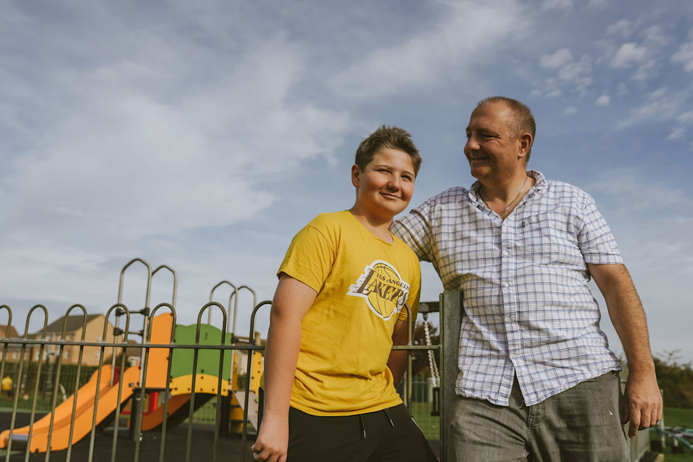 Shandor and Billy in front of a playground.