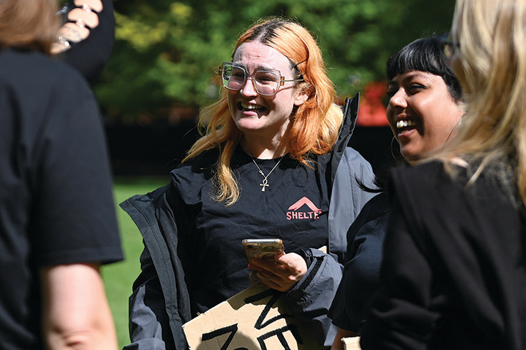 Campaigners outside, smiling and wearing Shelter T-shirts