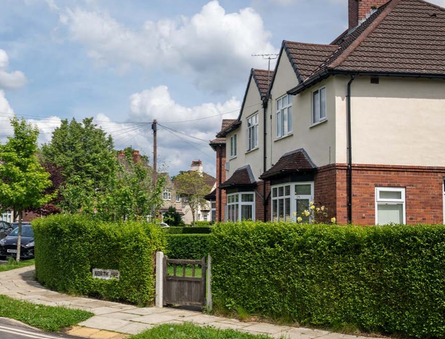 A row of houses on a suburban street.