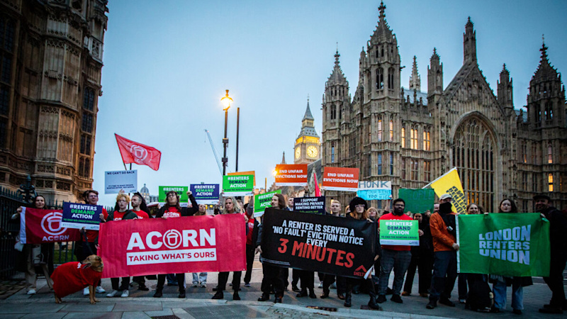 A rally of the Renters Reform Coalition. People are holding up banners, from Shelter, ACORN and the London Renters Union.