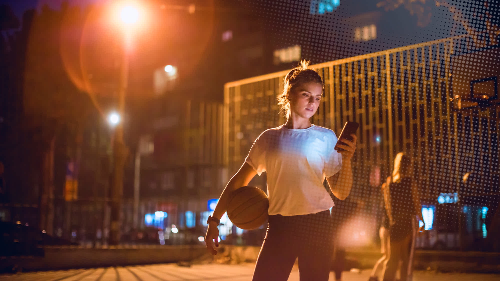 Basketball player checking her phone