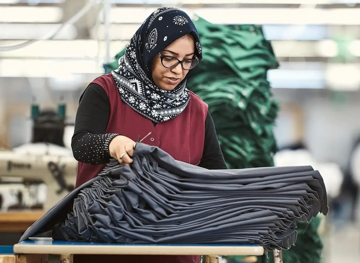 Person uring the manufacturing process of the brand PB by Bierbaum-Proenen in the factory.