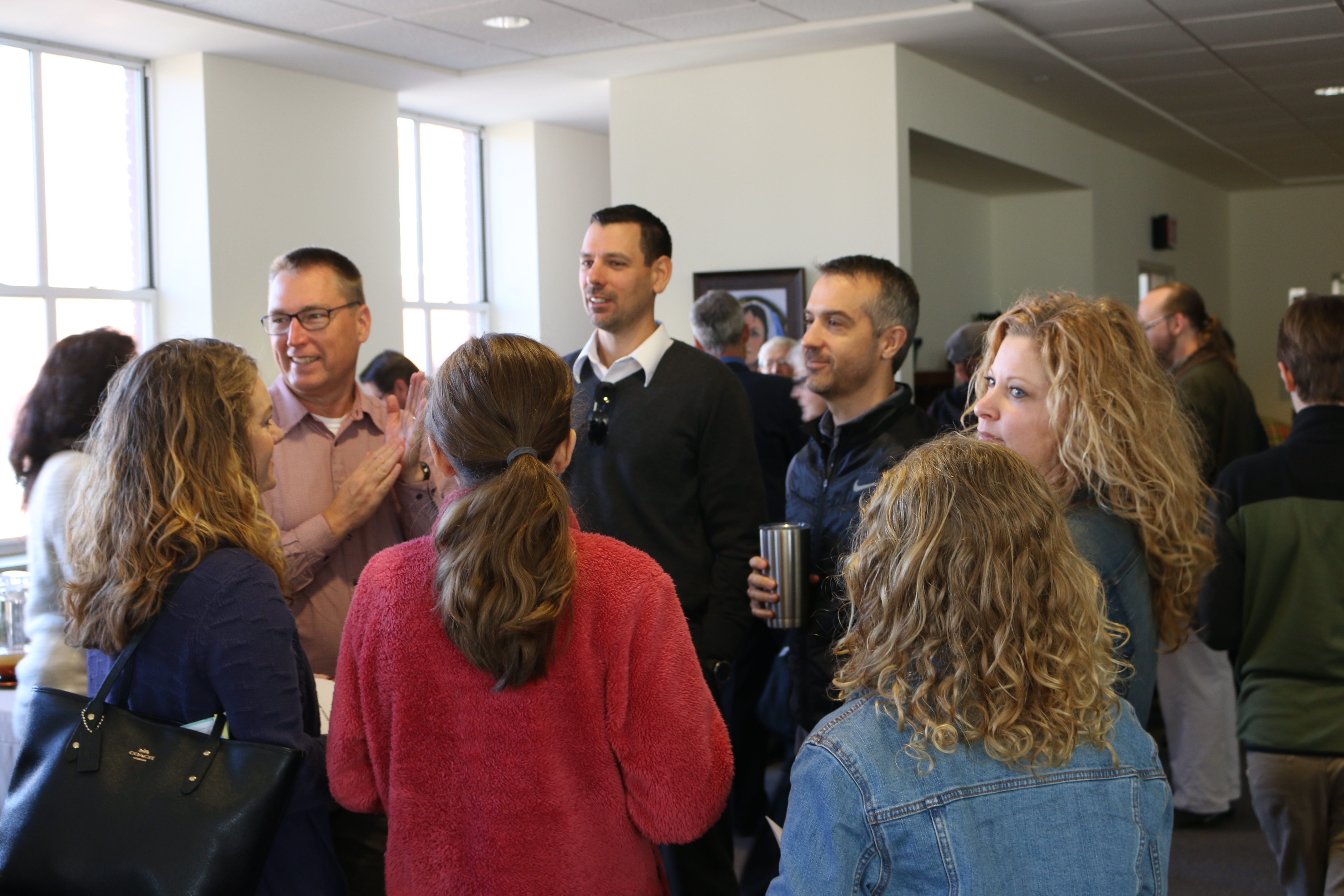 Group of people standing and talking
