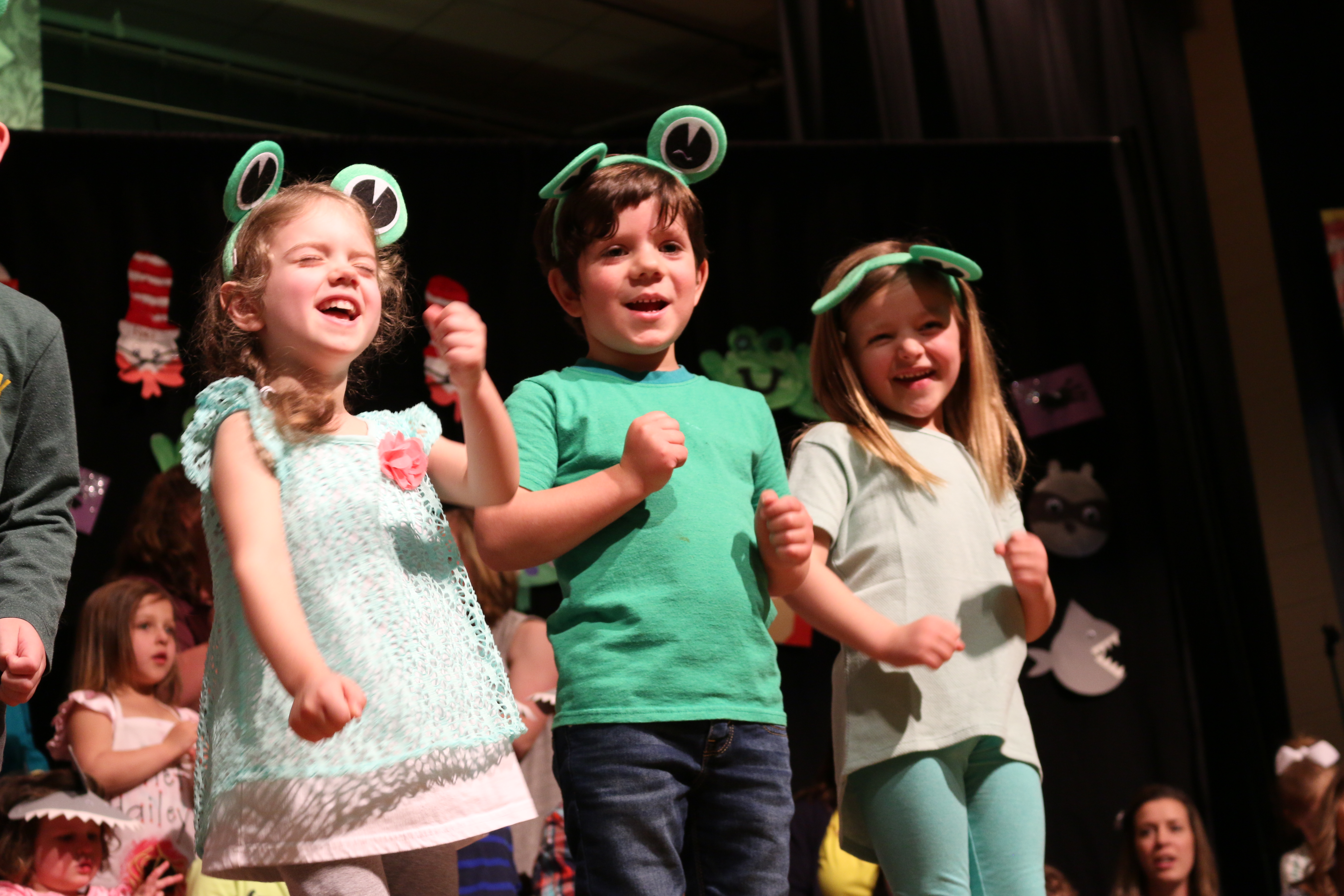 Kids performing a dance and song