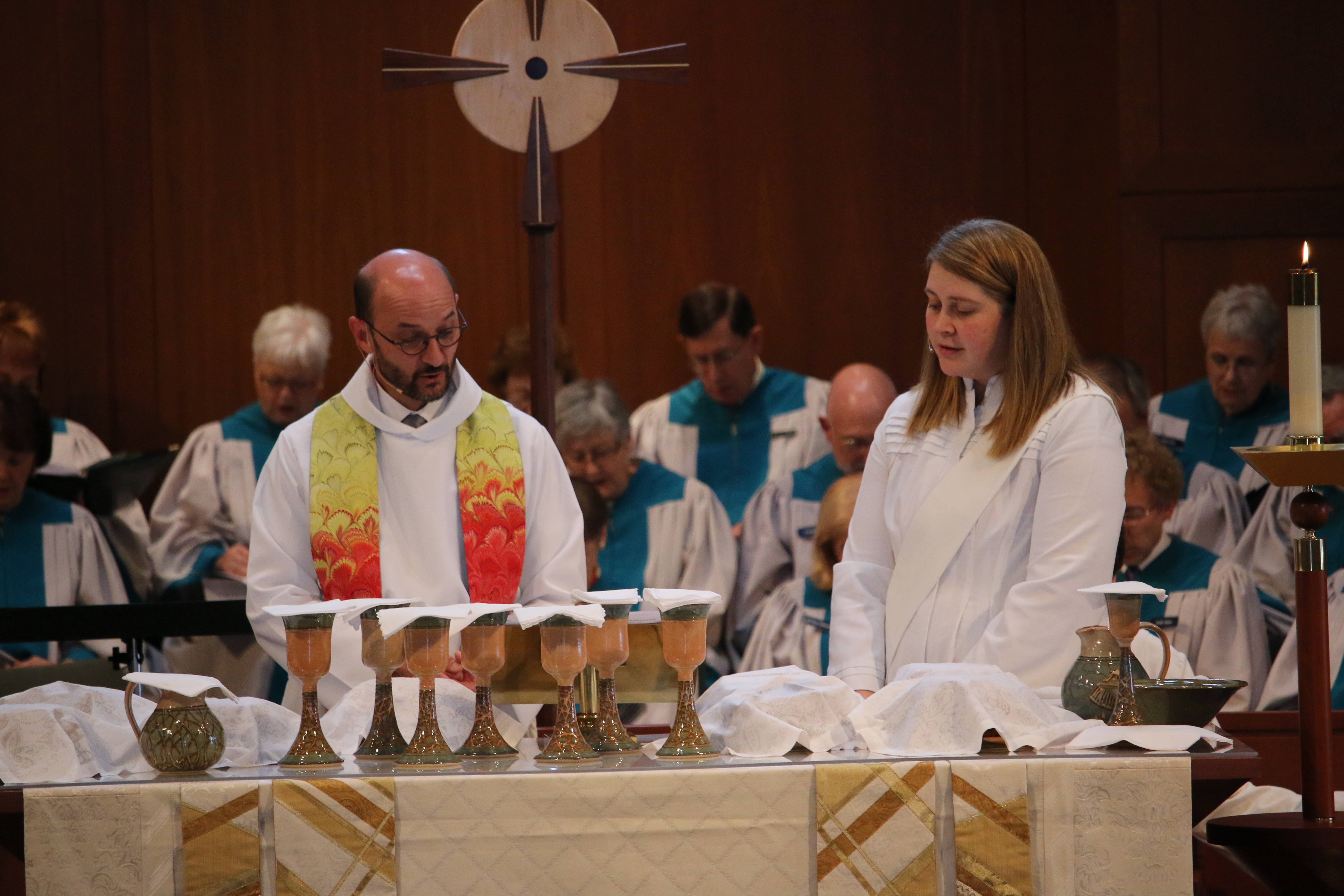 Keith Turman and Becky Brown preparing Lord's Supper