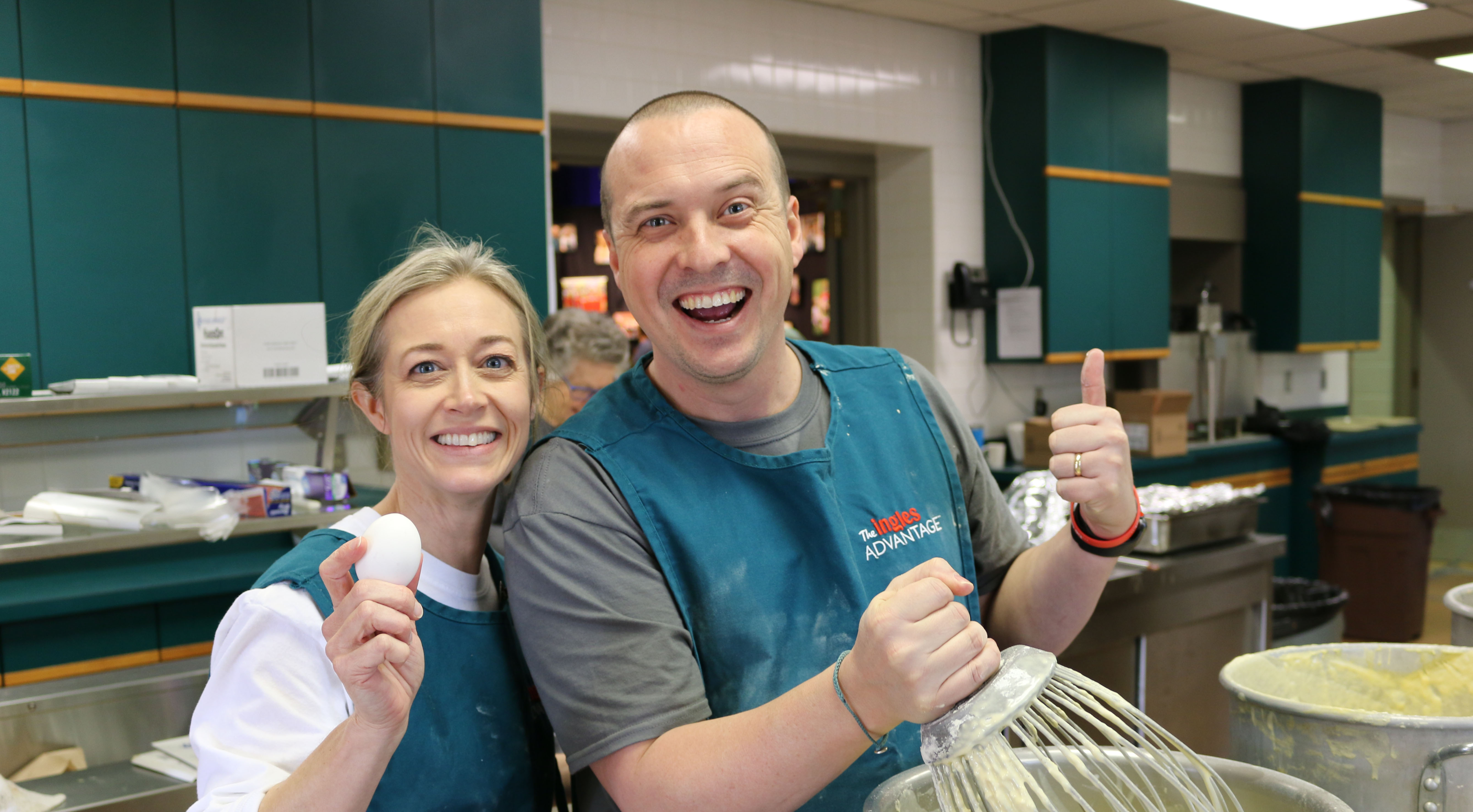 Two people making pancakes