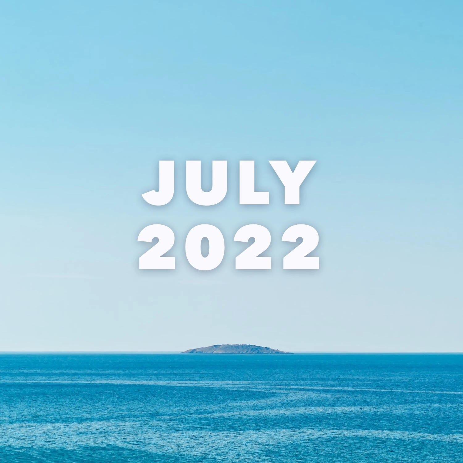 July 2022 text over ocean view