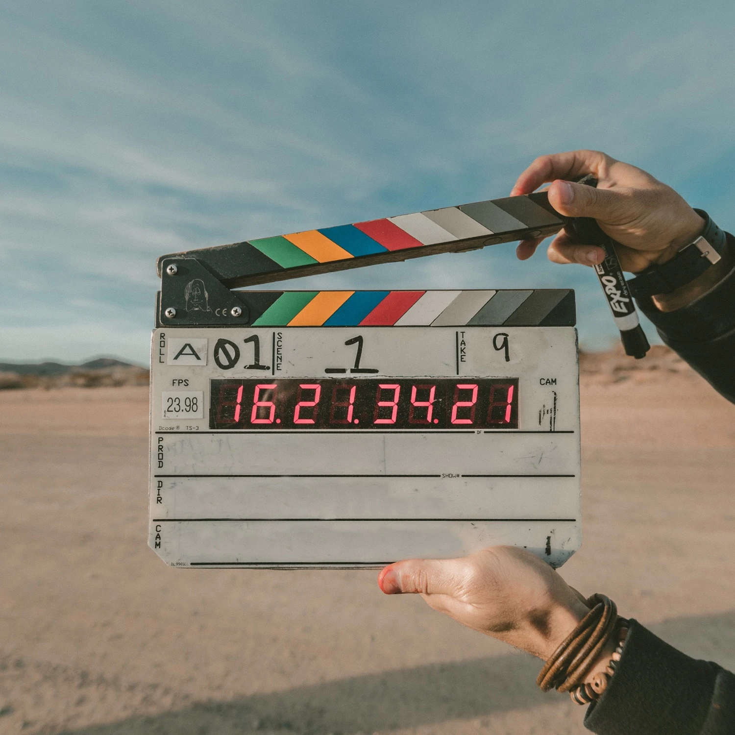 Colored clapperboard in a desert scene