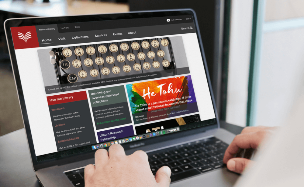 Checking out the National Library's He Tohu web pages on a laptop.