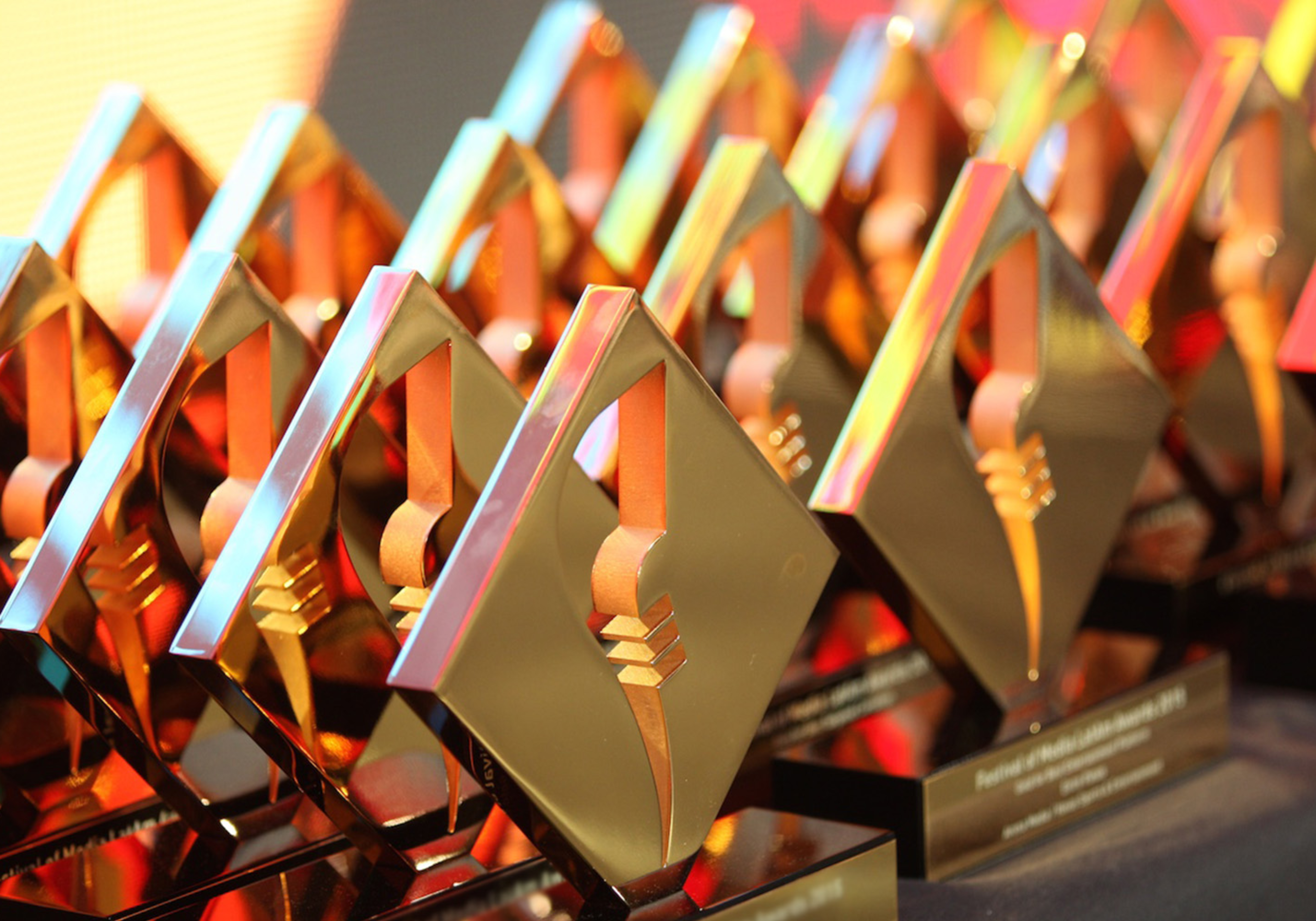 Rows of festival of media awards on a table 