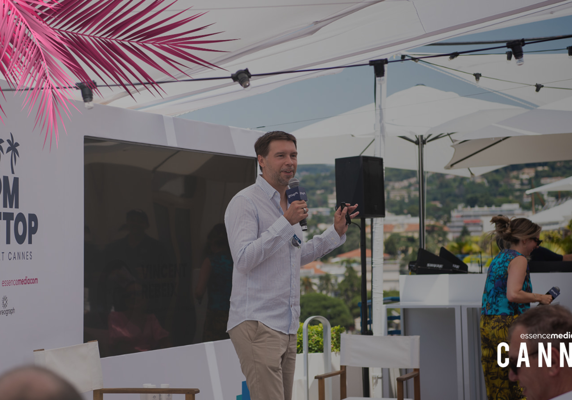 An image of Vincent Rebeix holding a mic at the EssenceMediacom panel on Generative AI at Cannes