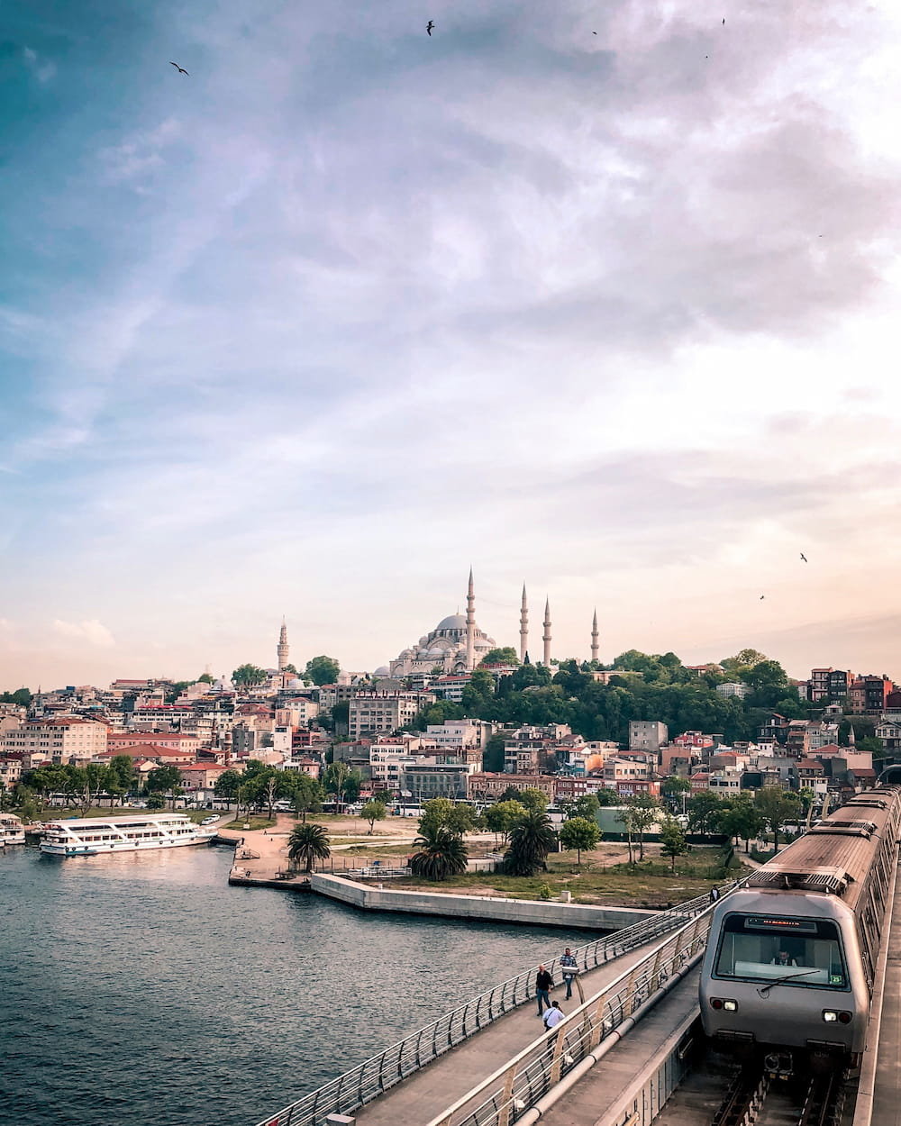Image of Istanbul with tram crossing a bridge over the river
