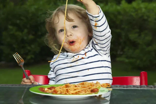 Toddler-eating-with-parent