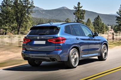 The rear exterior of a blue BMW X3