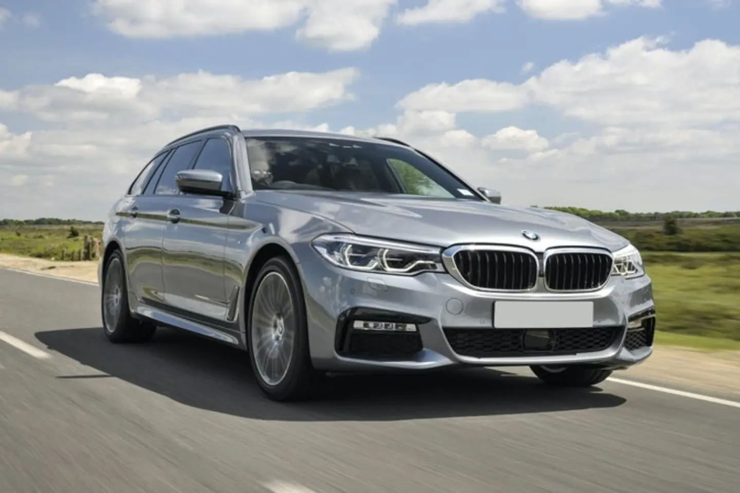 The exterior of a silver BMW 5 Series