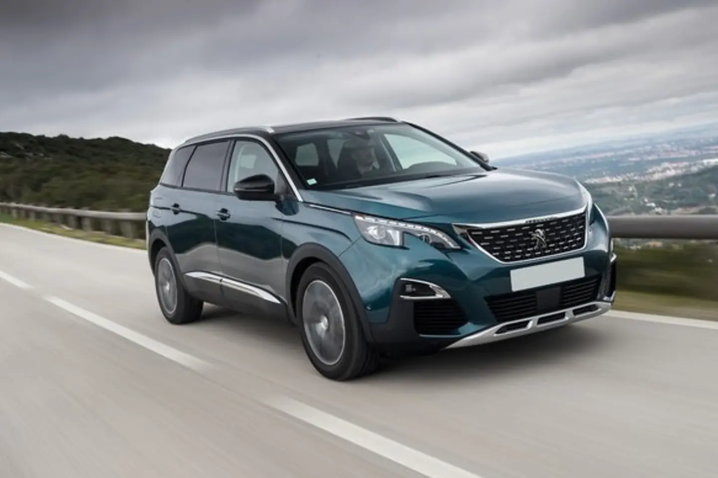 The front exterior of a green Peugeot 5008