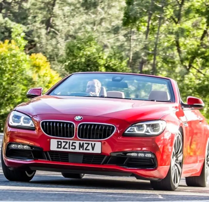 2015 BMW 650i Convertible [red] driving