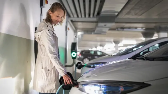 An electric car being charged up