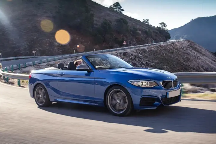 The front exterior of a blue BMW 2-Series