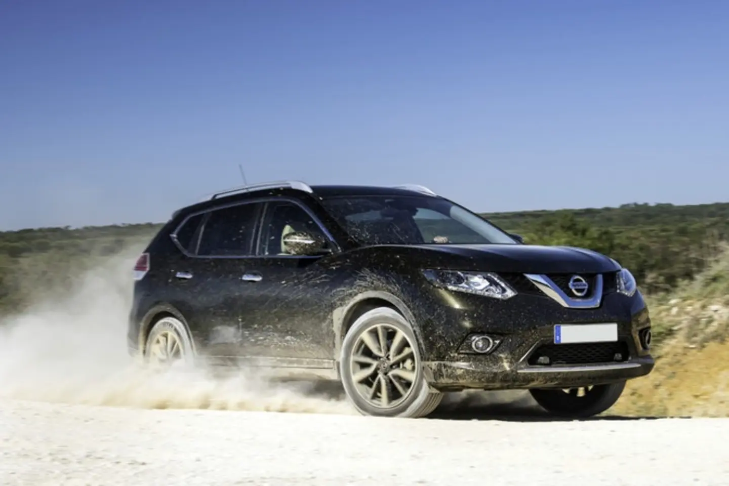 The front exterior of a black Nissan X-Trail