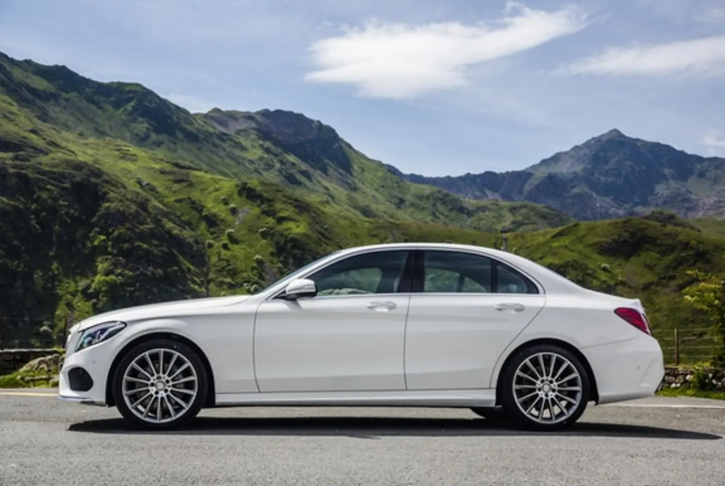 The side exterior of a white Mercedes-Benz C-Class