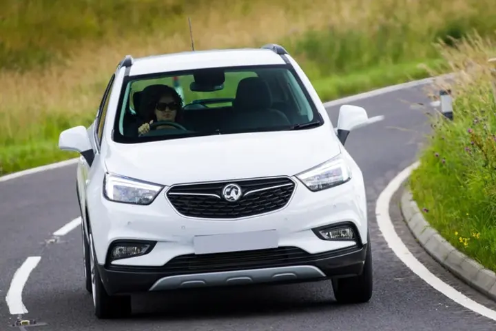 The front exterior of a white Vauxhall Mokka X