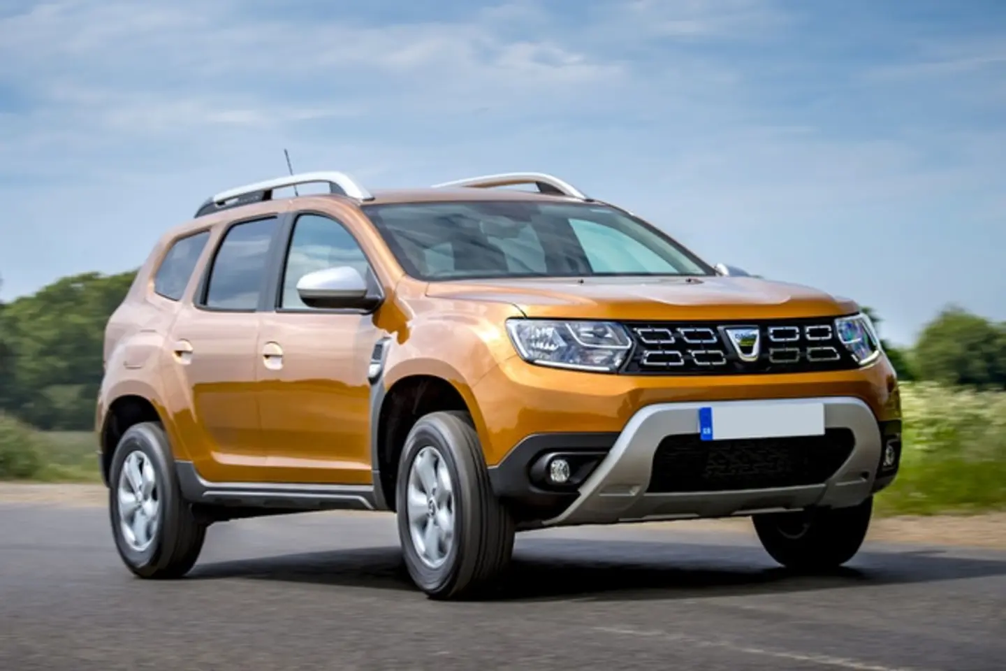 The exterior of a yellow Dacia Duster