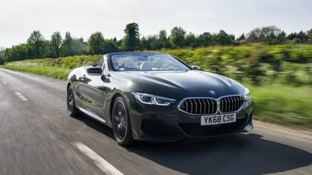 2019 BMW 840d M Sport Convertible [black] driving