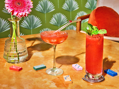 Signature cocktail highball and coupe red cocktails