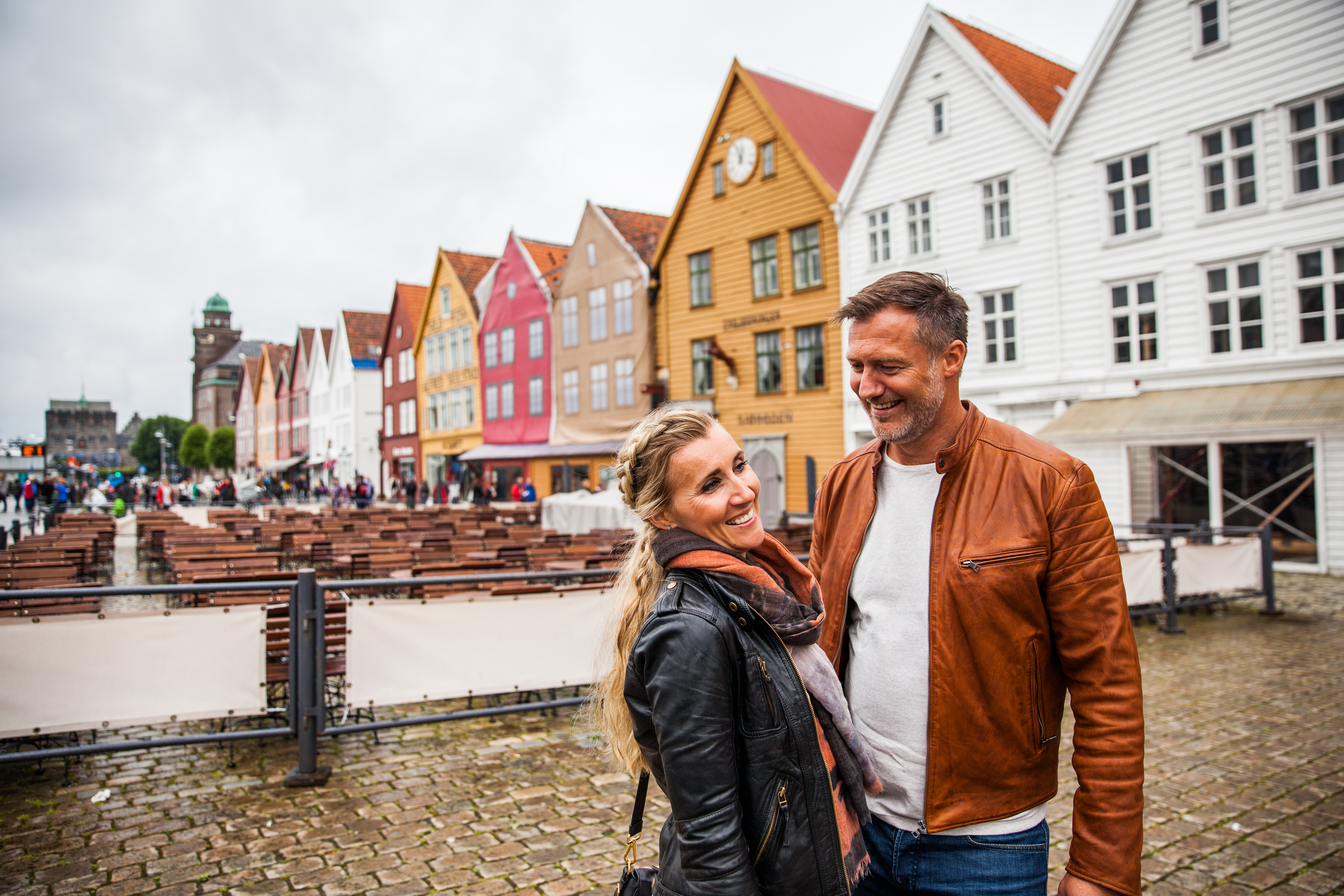Norway Bergen Bryggen couple smiling credit Martin Håndlykken - VisitNorway.com