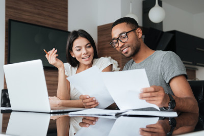 Woman and Man in Office Looking at Papers