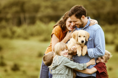 Family Hugging with Puppy