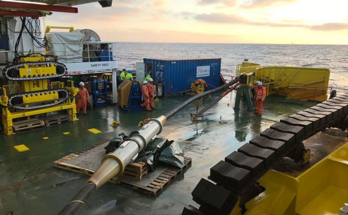 Repair ship mending a damaged submarine cable