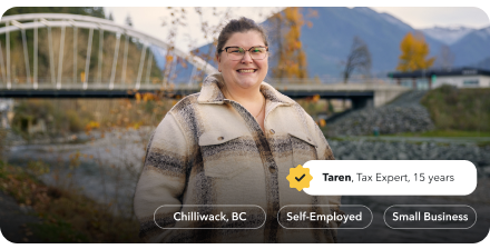 Taren, a tax expert of 15 years, is smiling warmly in a park in Chilliwack with a mountain range behind her.