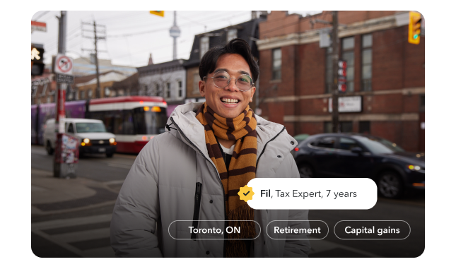 Fil, a tax expert of 7 years, is smiling warmly on the streets of Toronto.